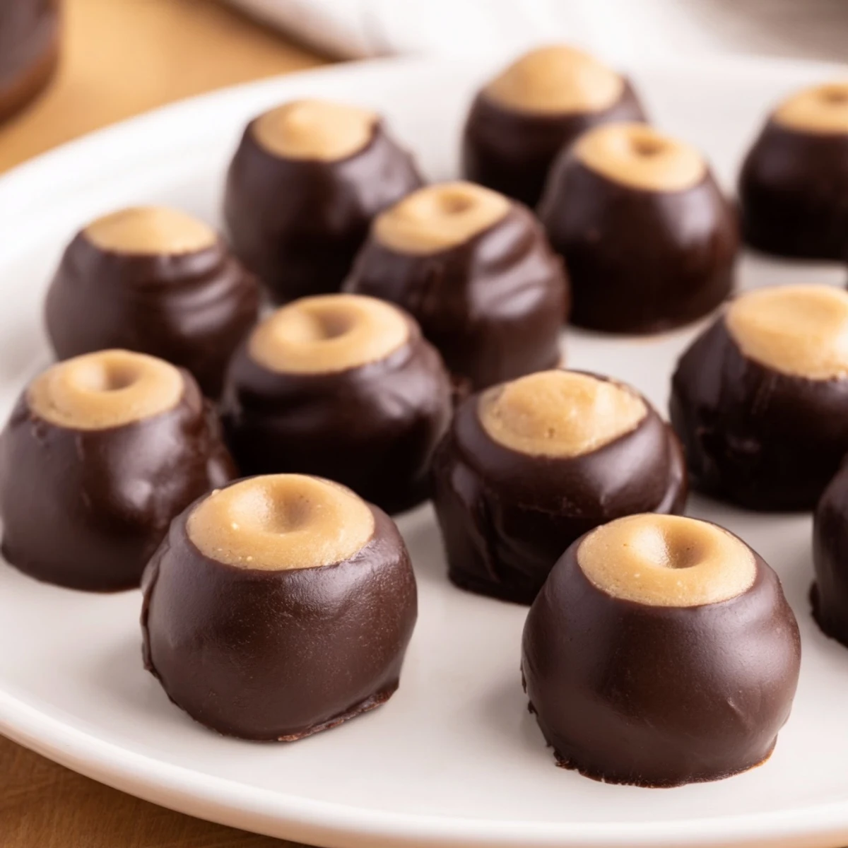 These decadent buckeyes feature a delightful combination of peanut butter and melted chocolate flavors.