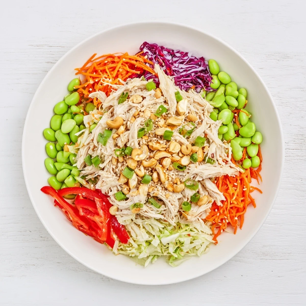 Colorful Edamame Crunch Chicken Salad tossed with edamame, green onions, and a honey-ginger dressing, ready to enjoy with iced green tea.