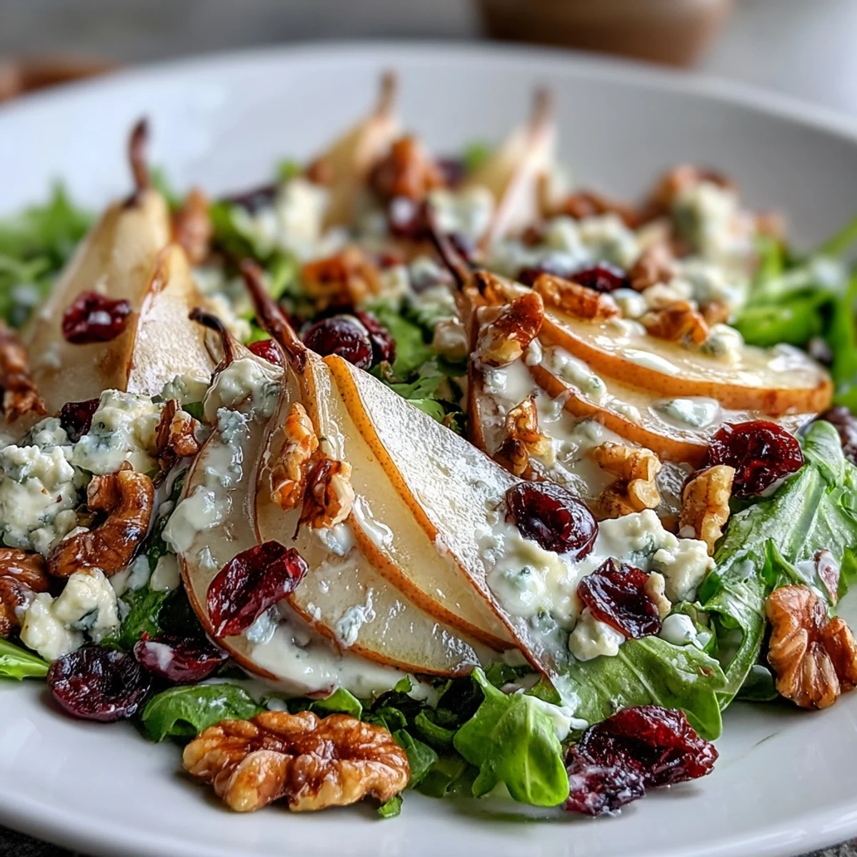 Refreshing Pear Gorgonzola Salad, a perfect elegant starter with crisp greens.