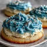 Classic vanilla sugar cookies inspired by Cookie Run Kingdoms Pure Vanilla Cookie, topped with glossy royal icing and vibrant blue and yellow accents.