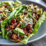 These low carb turkey taco lettuce wraps are bursting with flavor and vibrant garnishes.