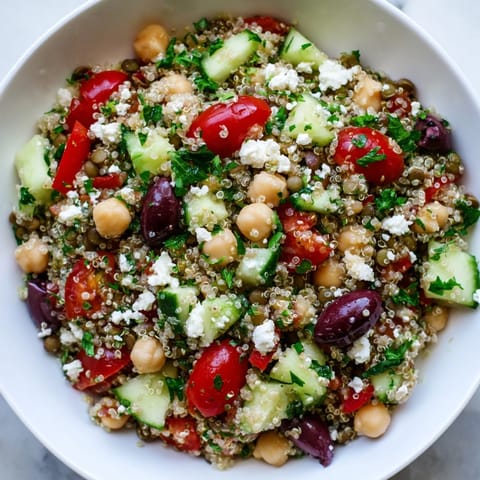 Hearty Greek Power Salad served in a white bowl, perfect for a nutritious lunch or light dinner.